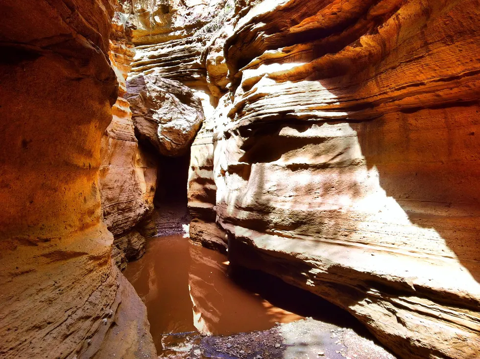 A boulder between the walls of a slot canyon in Hell’s Gate National Park, Kenya.